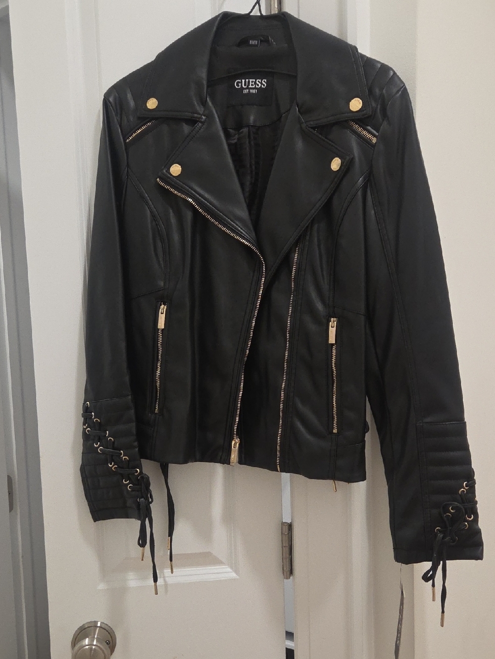 GUESS Black Faux Leather Moto Jacket with Gold Hardware and Lace-Up Cuffs